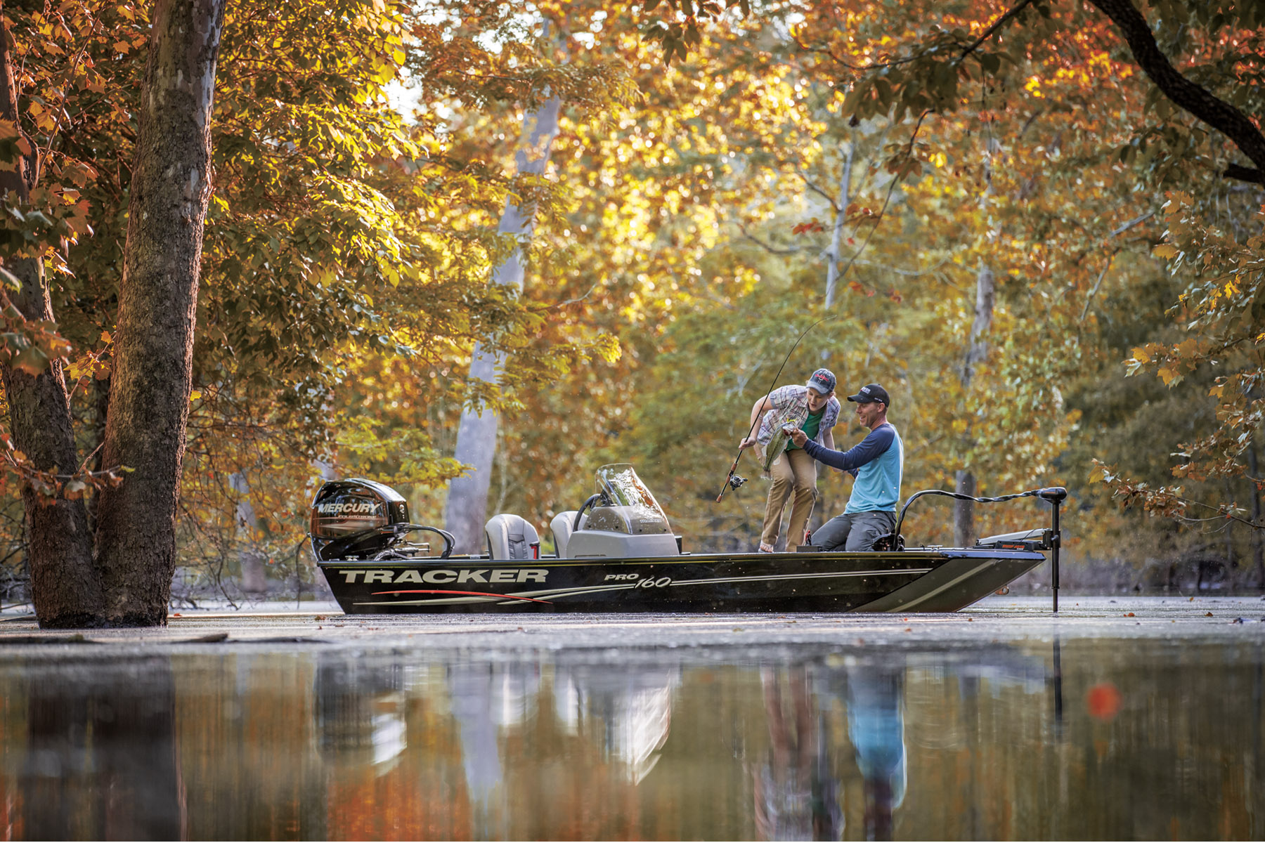 Two men fishing on Tracker Boat