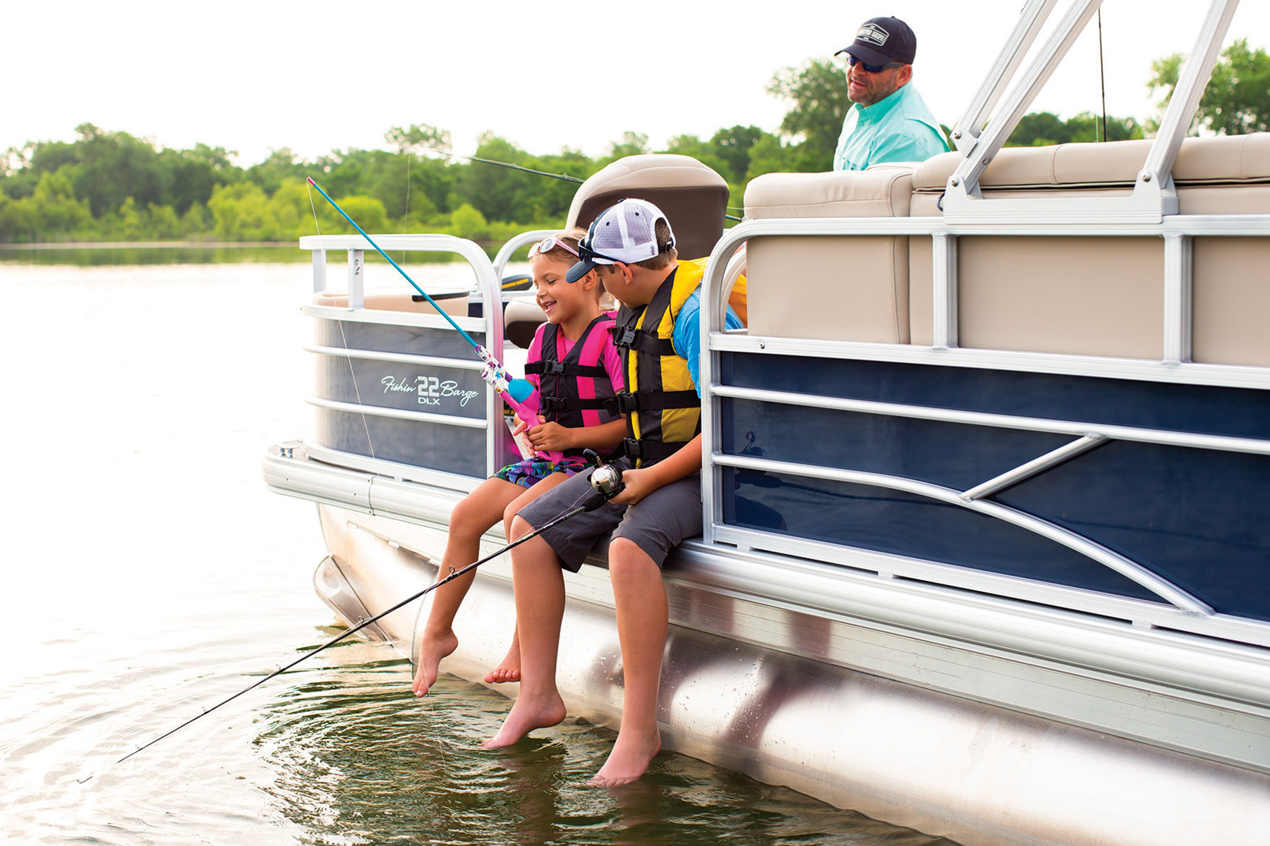 Family Enjoying Sun Tracker Boat