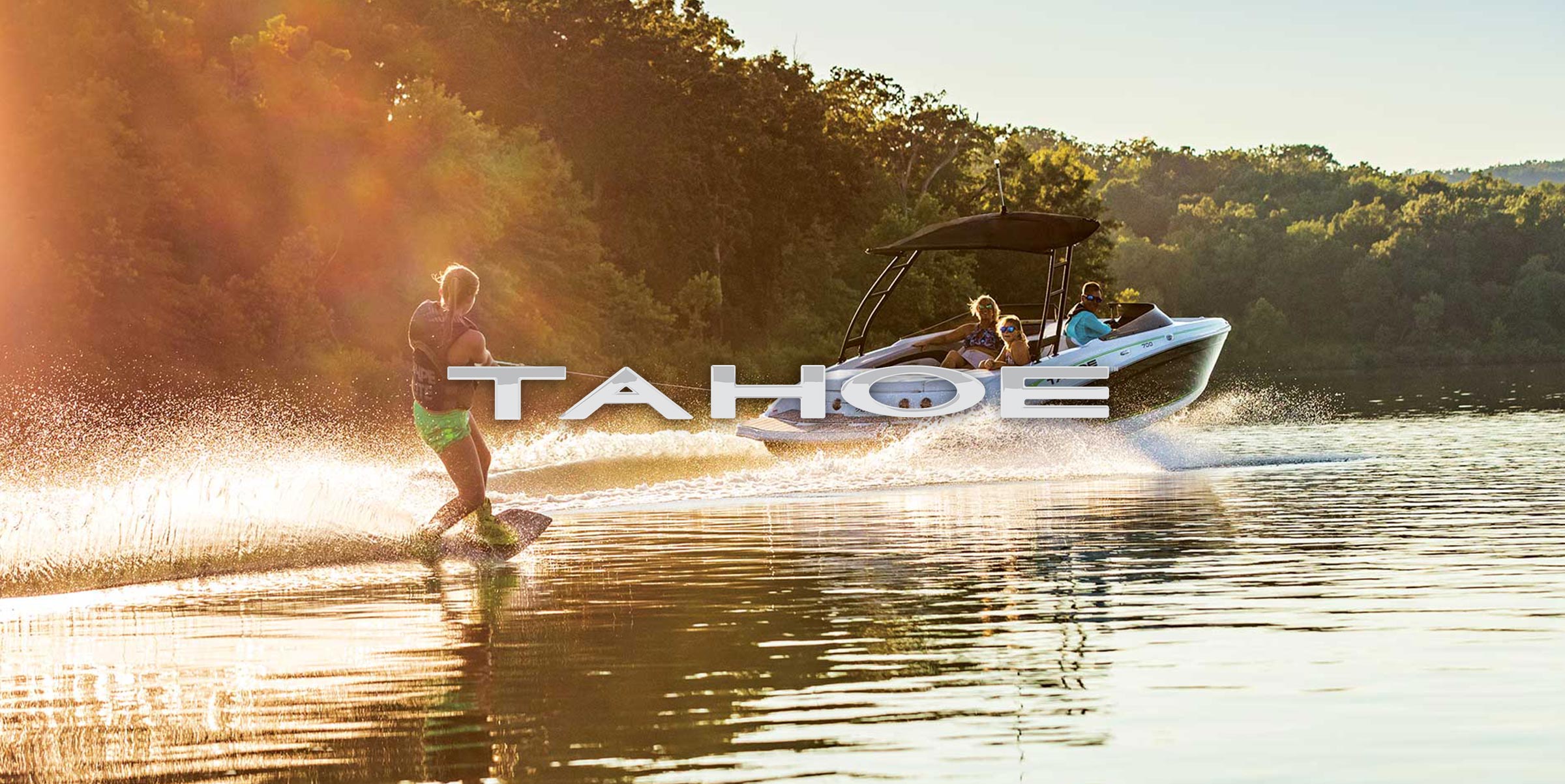 Tahoe logo on Tahoe Boat pulling wakeboarder